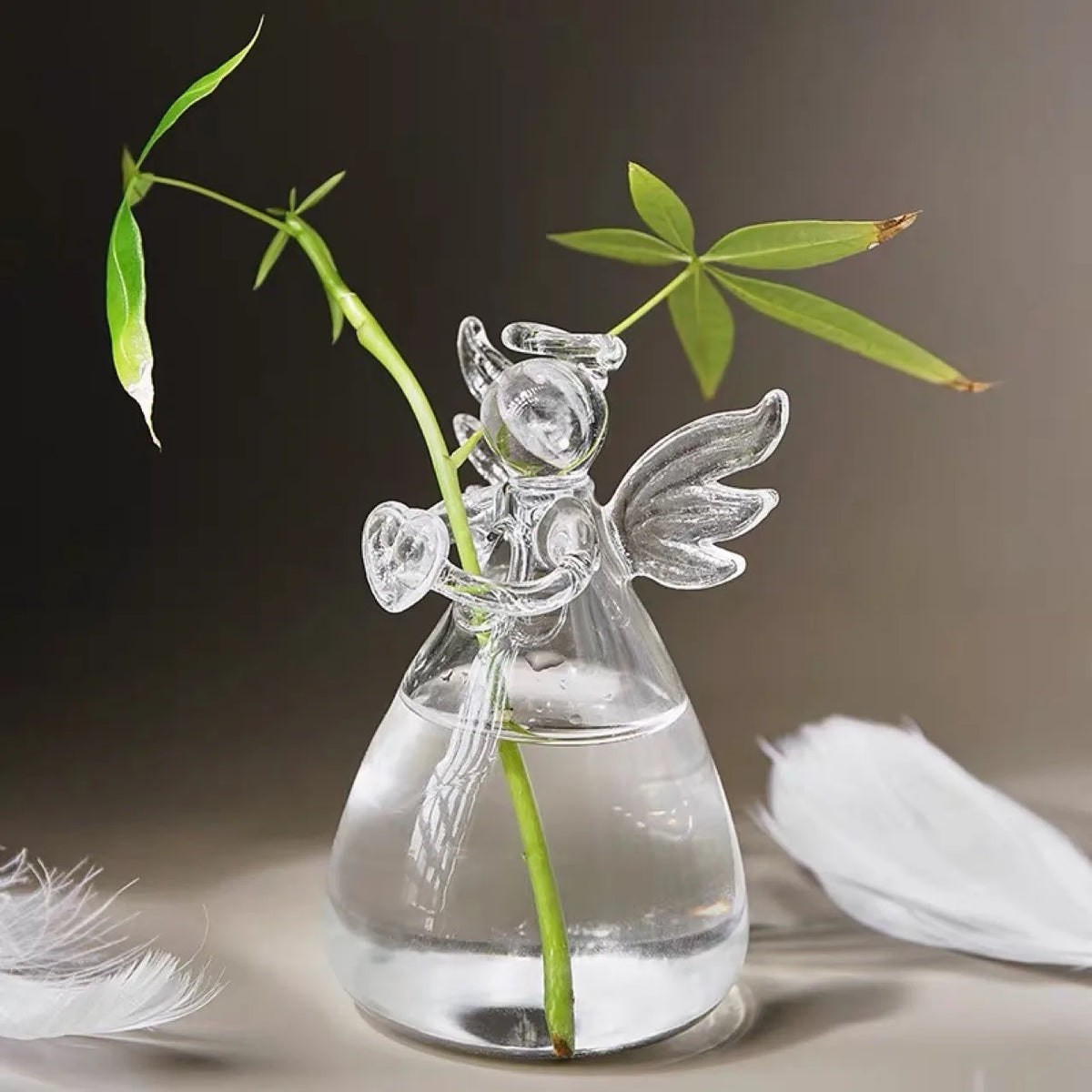Pair of crystal angel figurine vases arranged on dressing table display