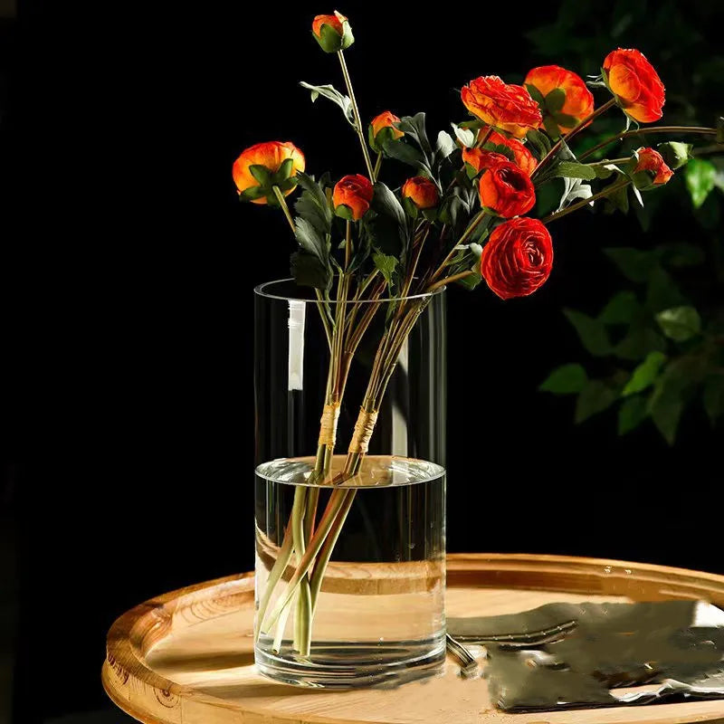 Small glass cylinder vase 6.5x10cm with fresh green plant on nightstand