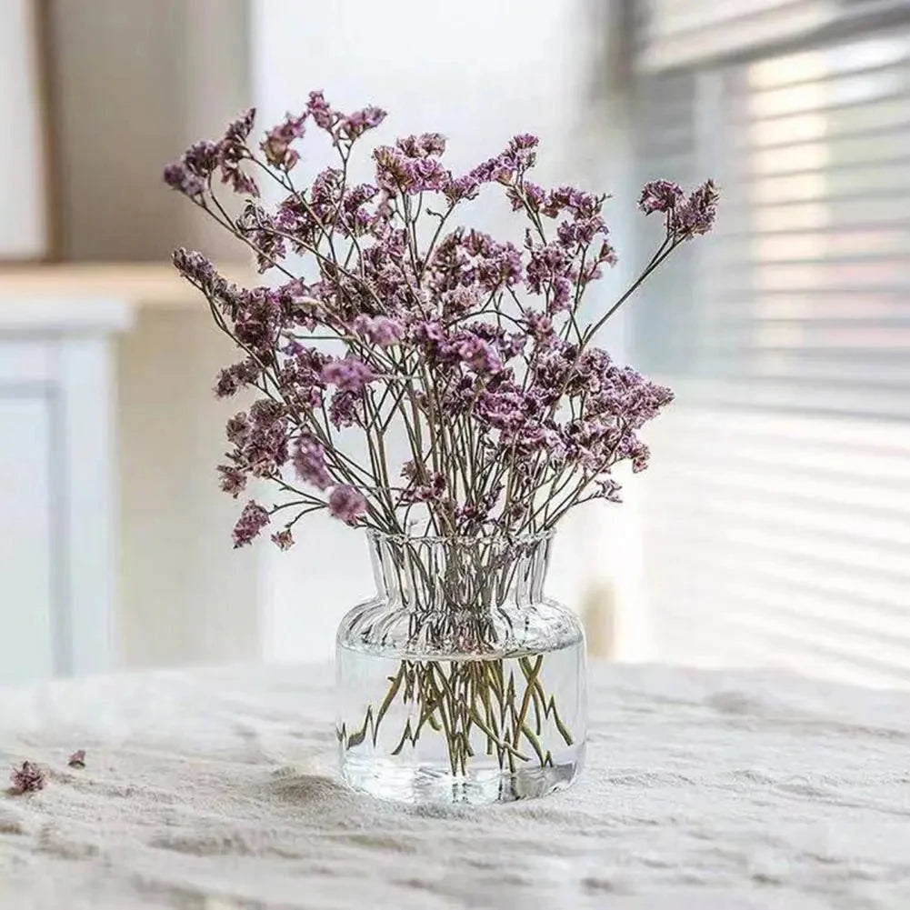 Close-up of clear glass bottle vase with clean Nordic minimalist silhouette