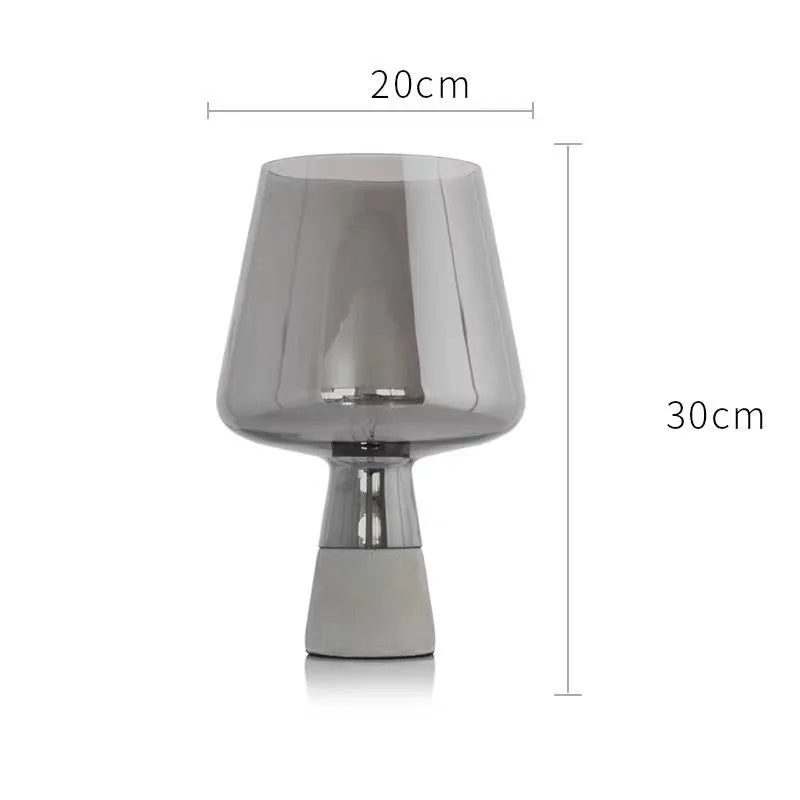 Luxury glass mood lamp in lifestyle setting with books and plants