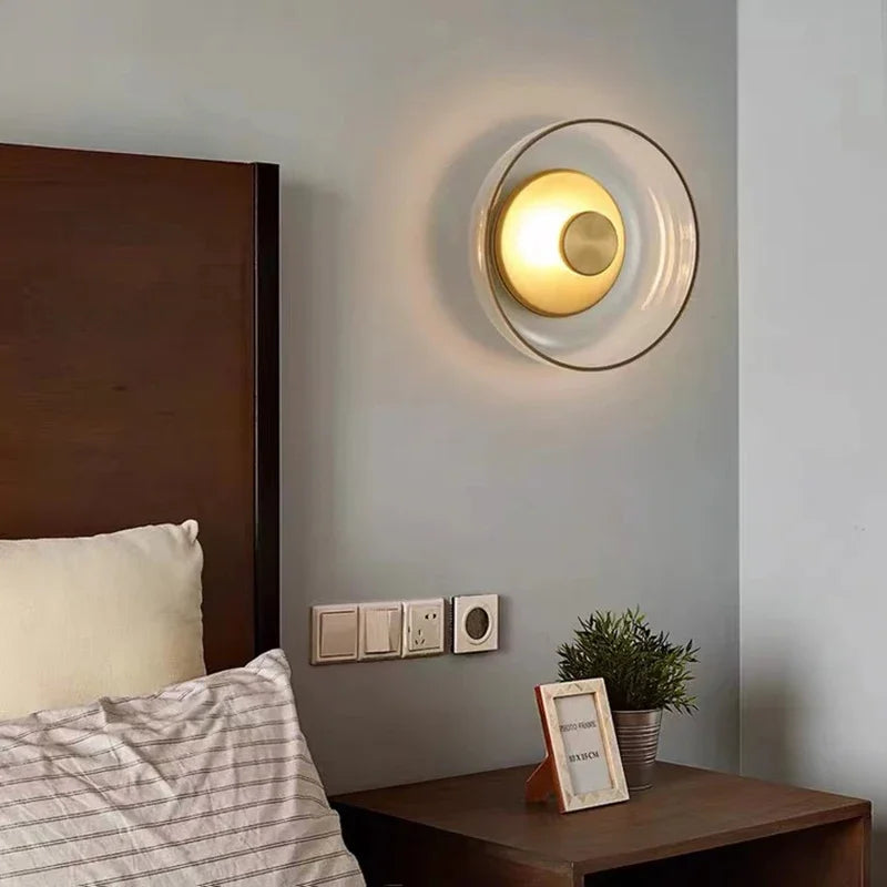 glass wall sconce, detail view of fixture base and arm