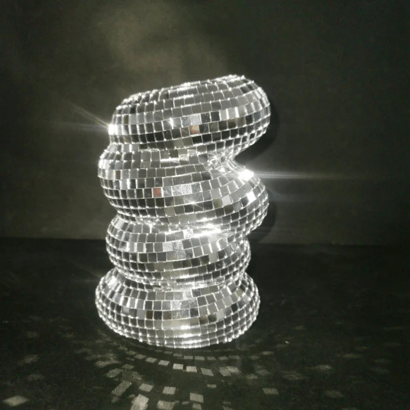 Silver mirrored glass disco ball vase on home shelf centerpiece