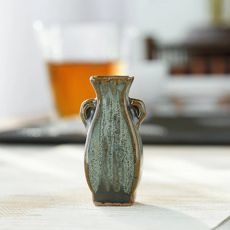 Ceramic miniature vase group styled as living room vignette