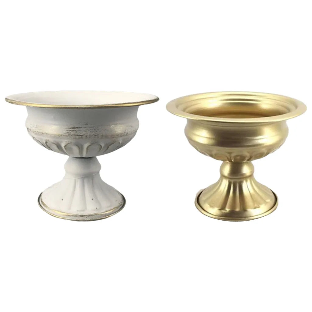 Multiple gold metal vase candle holders in a wedding aisle floral arrangement