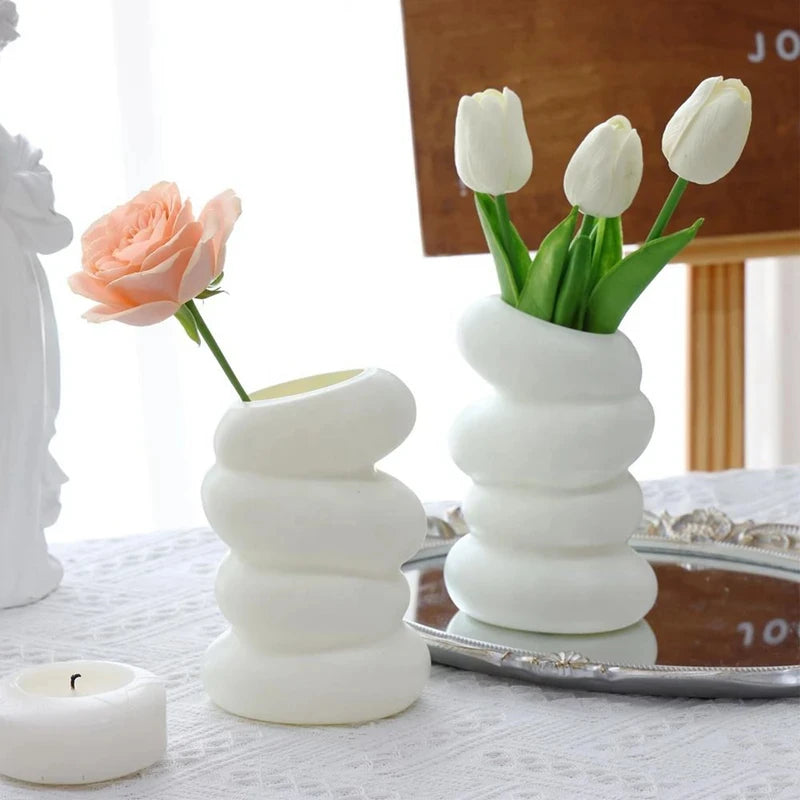Close-up of spiral ribbed texture on white plastic Nordic decorative vase