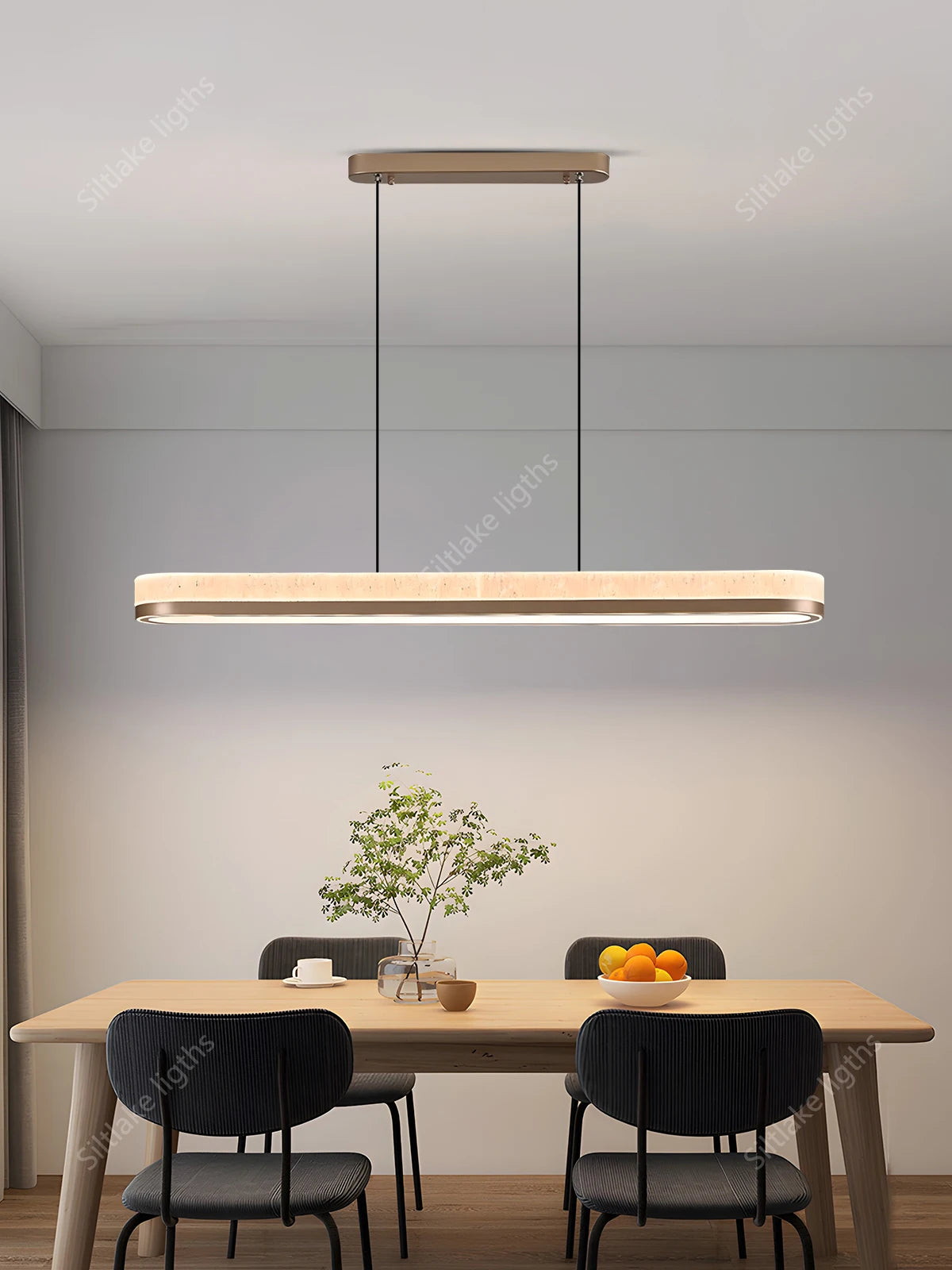 Acrylic blades on a champagne framed Nordic linear chandelier