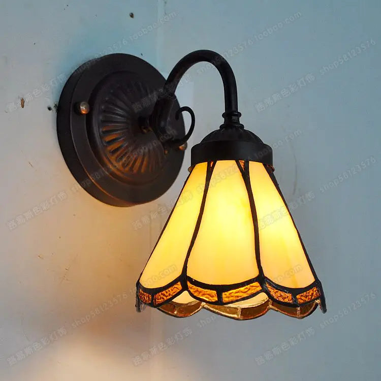 glass bathroom wall sconce, installed in a room interior setting
