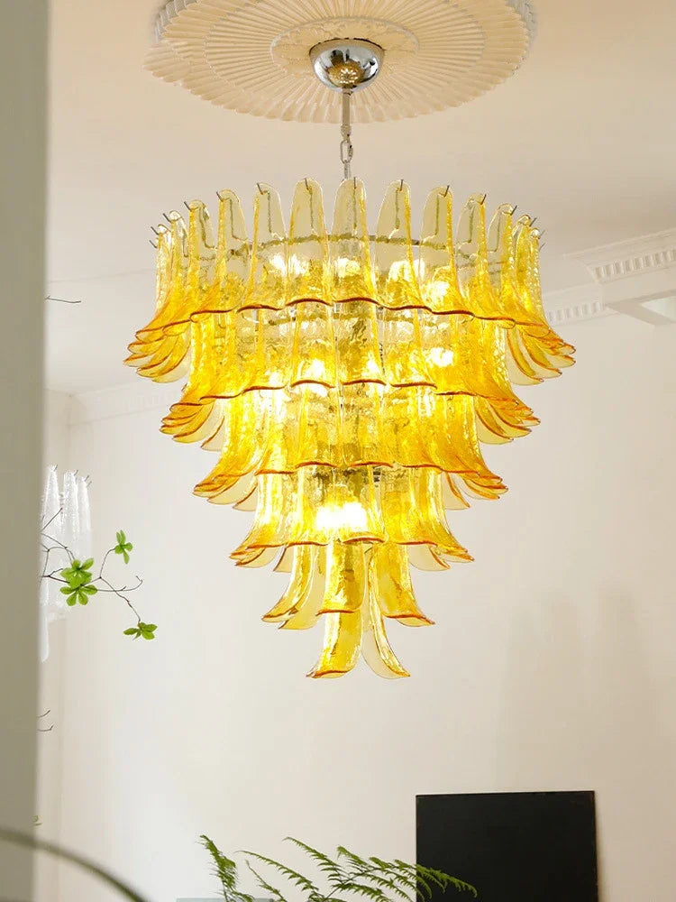White glass petal shades circling a chrome stainless steel chandelier frame