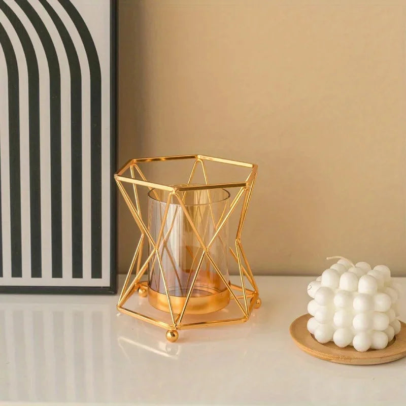 Side profile of gold iron geometric glass vase showing angular metalwork detail