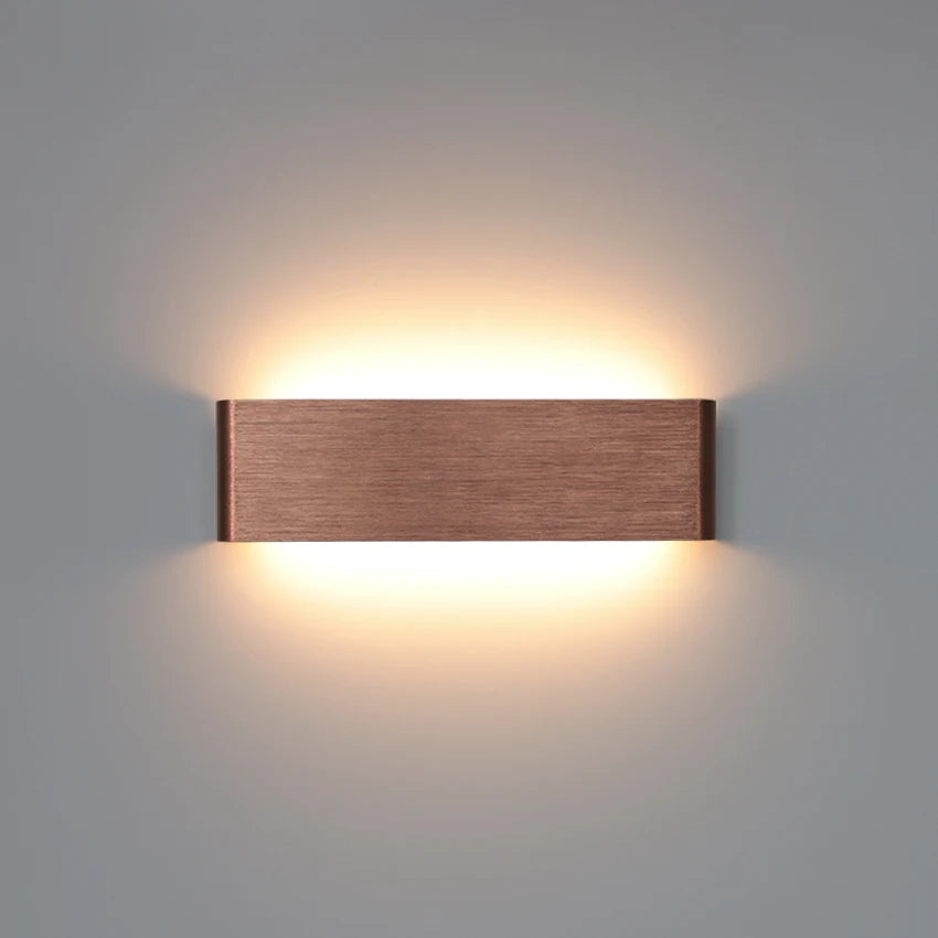 gold aluminum wall sconce, front view on white background