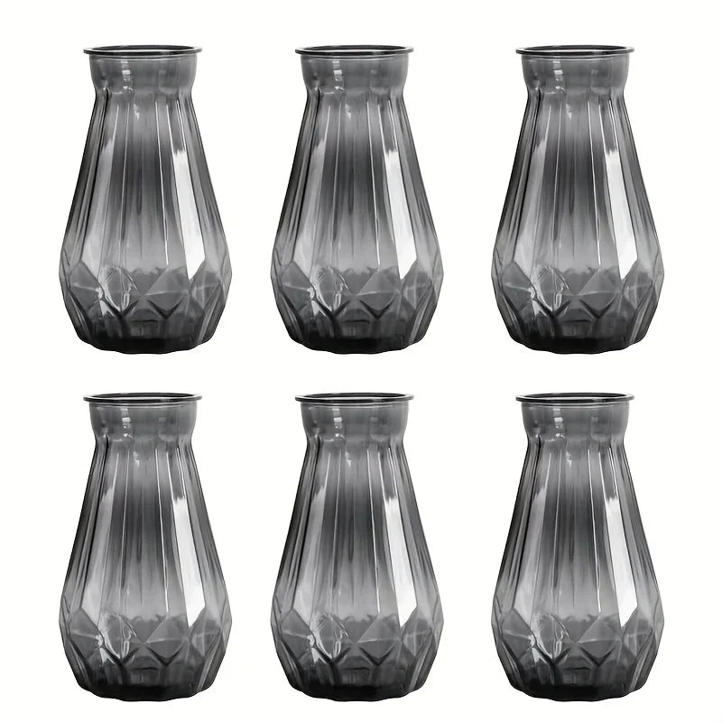 Transparent diamond facet plastic vase holding white roses for formal table