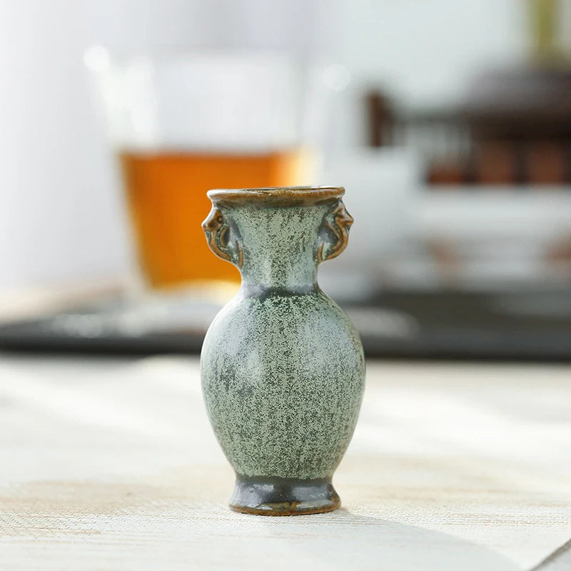 Retro Chinese style ceramic mini vase on console shelf
