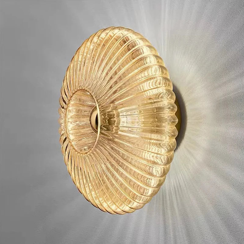 glass wall sconce, detail view of fixture base and arm