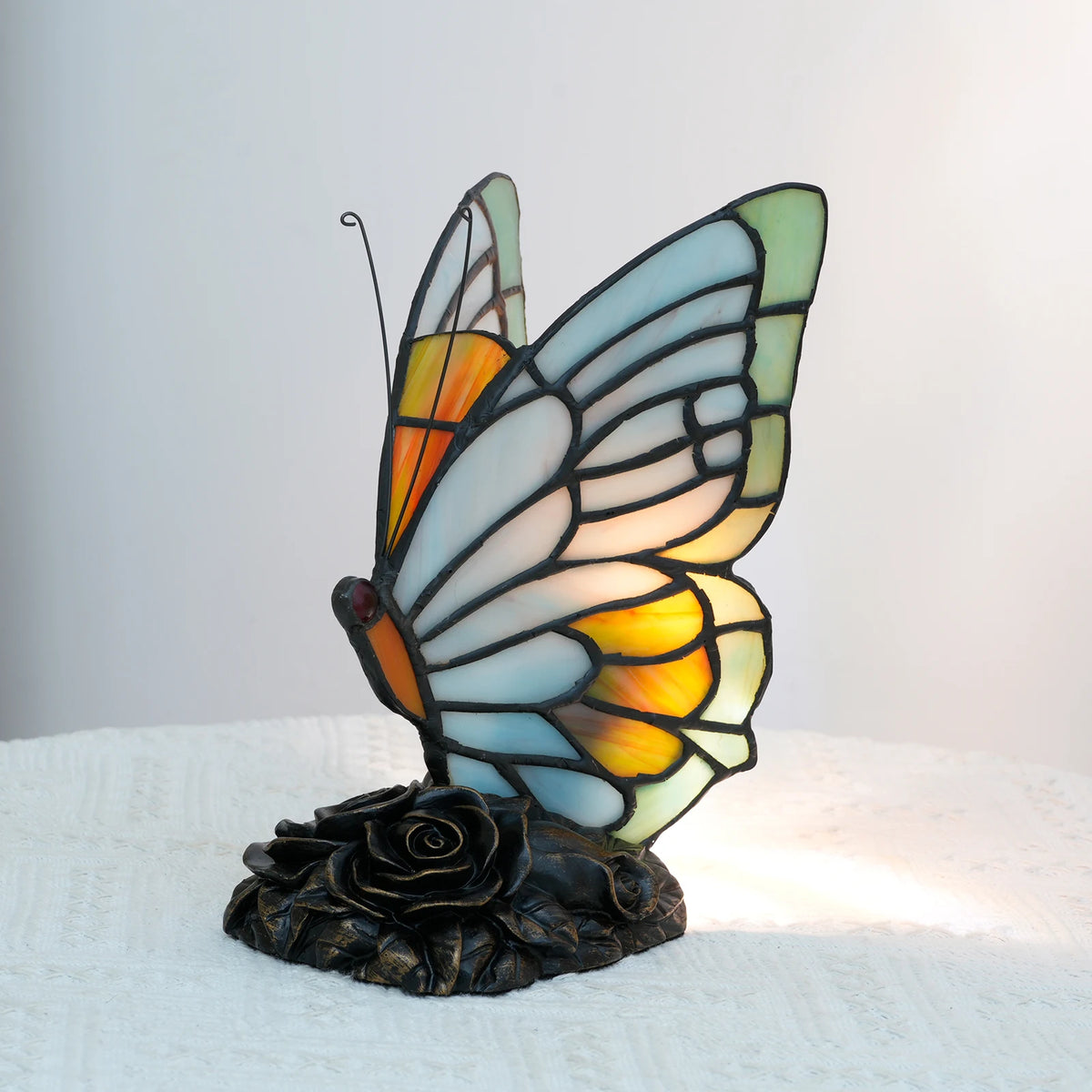 Tiffany butterfly lamp warm glow bedroom bedside jewel-toned light