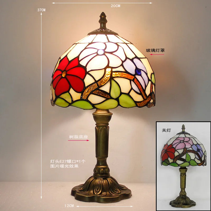 V type European Tiffany table lamp side profile view against white wall