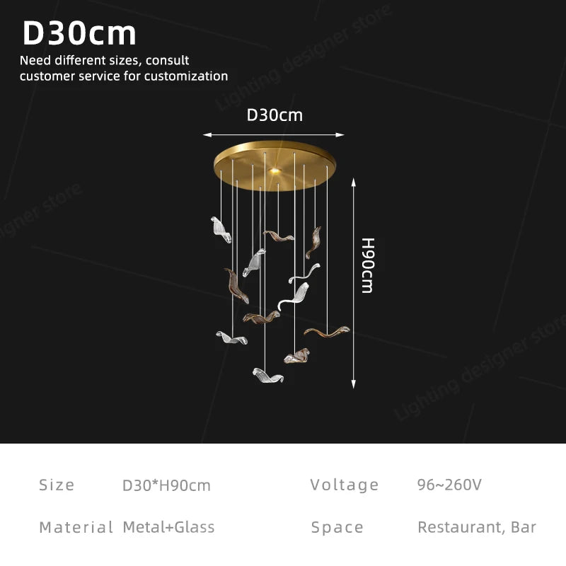 Linear glass chandelier lit in white 6000K light on plated metal