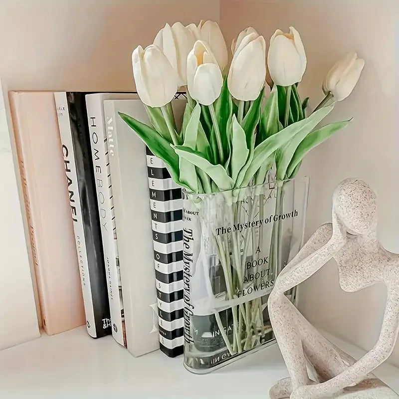 Close-up of clear acrylic book vase showing transparent walls and open book spine detail