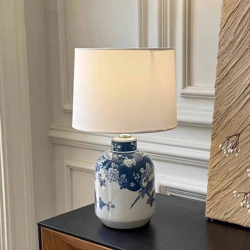 Blue and white porcelain vase table lamp in elegant bedroom setting