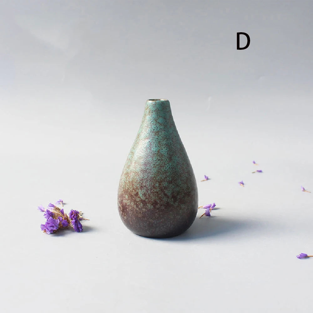 Wabi-sabi inspired ceramic small vase displaying single cotton stem
