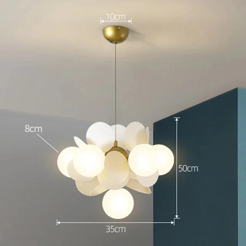 Ten head branch chandelier in white glass above a kitchen island