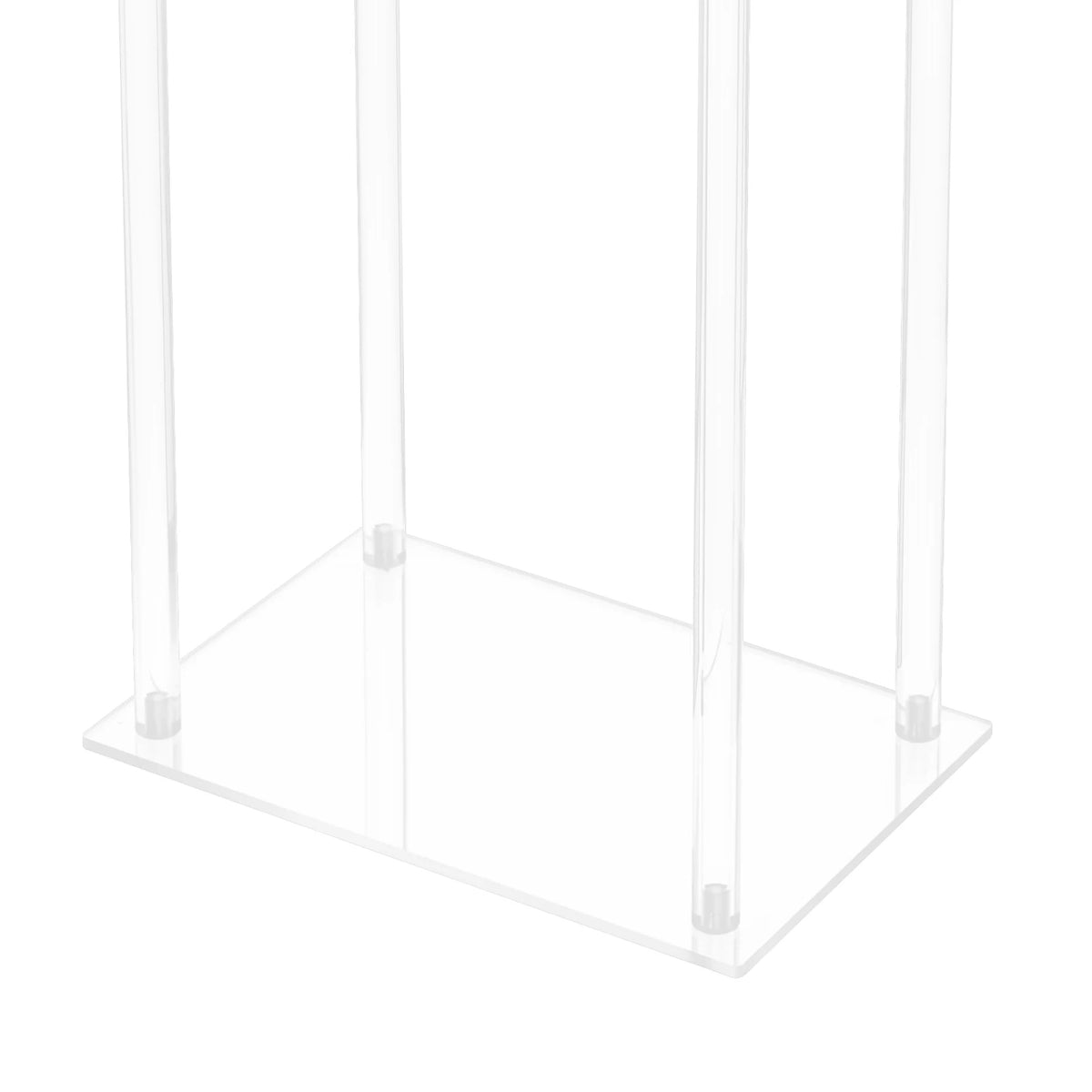 Multiple crystal clear flower stands arranged at varied heights in elegant wedding venue