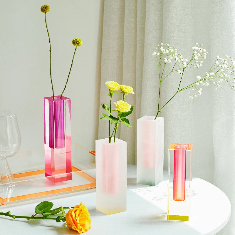 Collection of five frosted acrylic pillar bud vases in all color options displayed