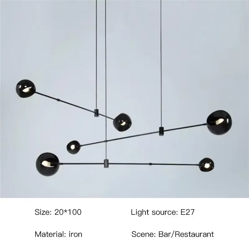 Industrial iron chandelier with round stained glass globes in a row