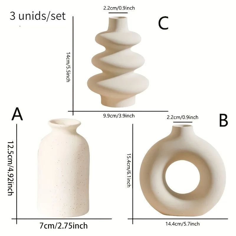 Side profile of three bohemian ceramic vases in contrasting white and black