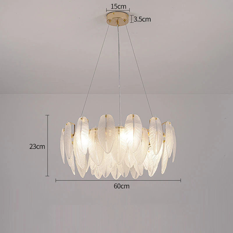 Matching feather glass wall lamp in a plated gold metal finish