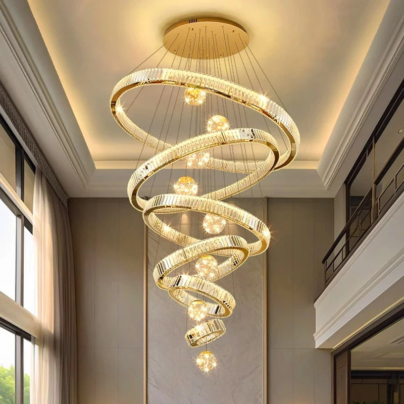 Crystal ring chandelier lit in warm white light down a stairwell