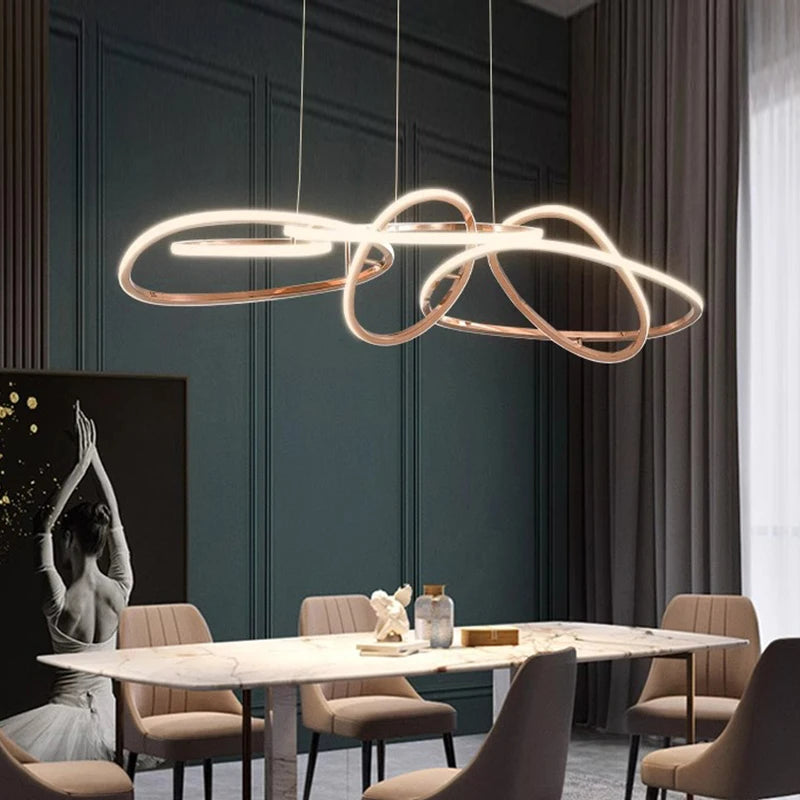 Gold linear pendant light switched on, warm white light mode