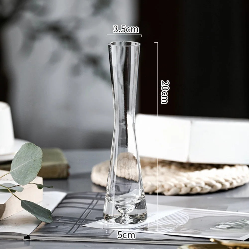 Set of glass flower vases with slanted openings displayed in multiple sizes