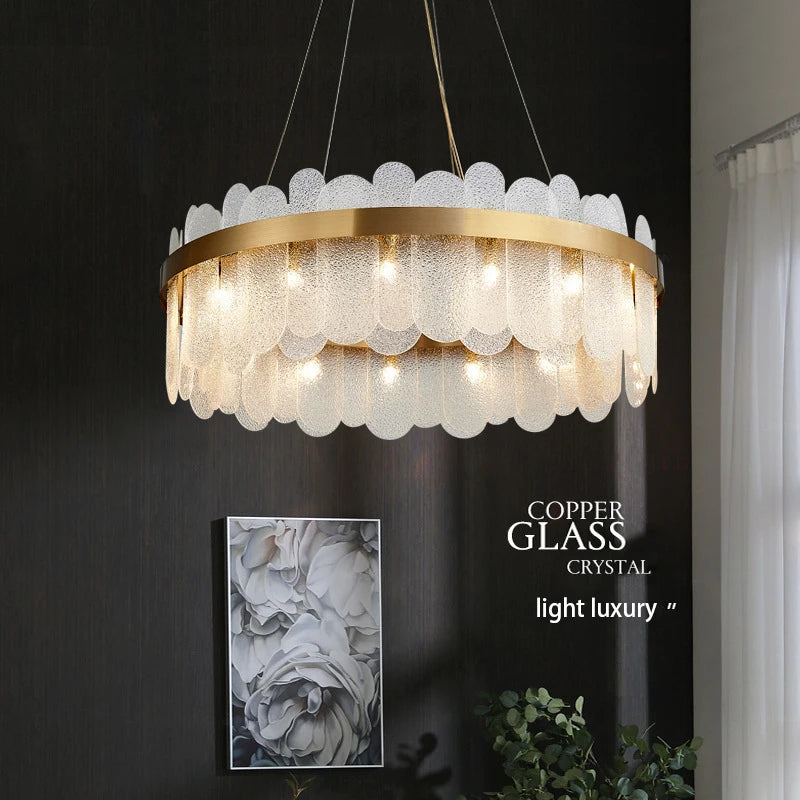 Gold ring glass chandelier with frosted glass set into an iron band