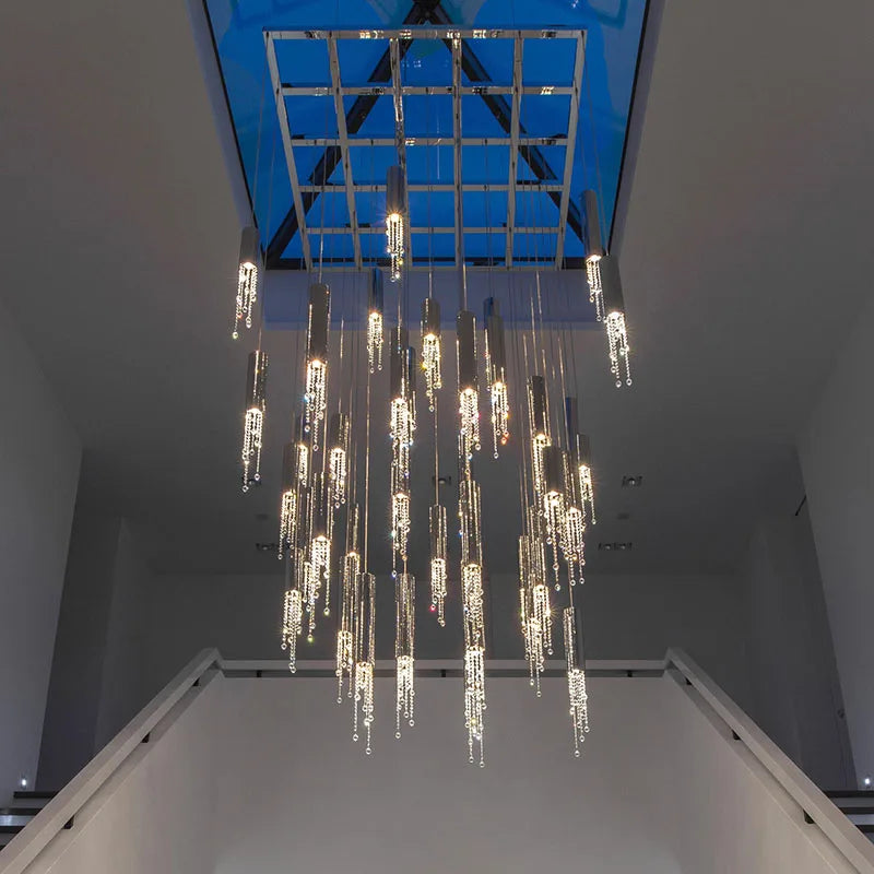 Crystal stairwell chandelier shown in warm light with knob switch control