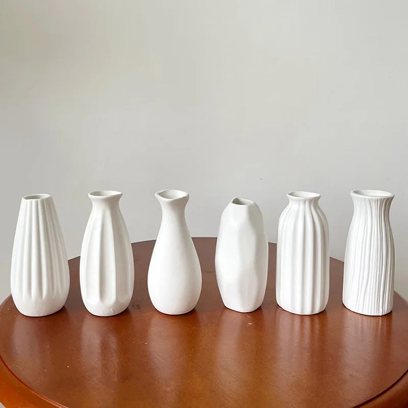 White ceramic vase with dried flower arrangement home decor