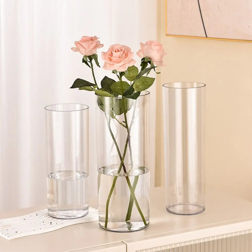Acrylic cylinder vase 15x30cm used as a wedding table centrepiece with white roses
