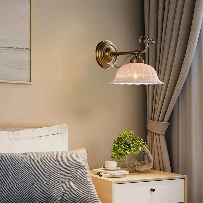 brass wall sconce, detail view of fixture base and arm