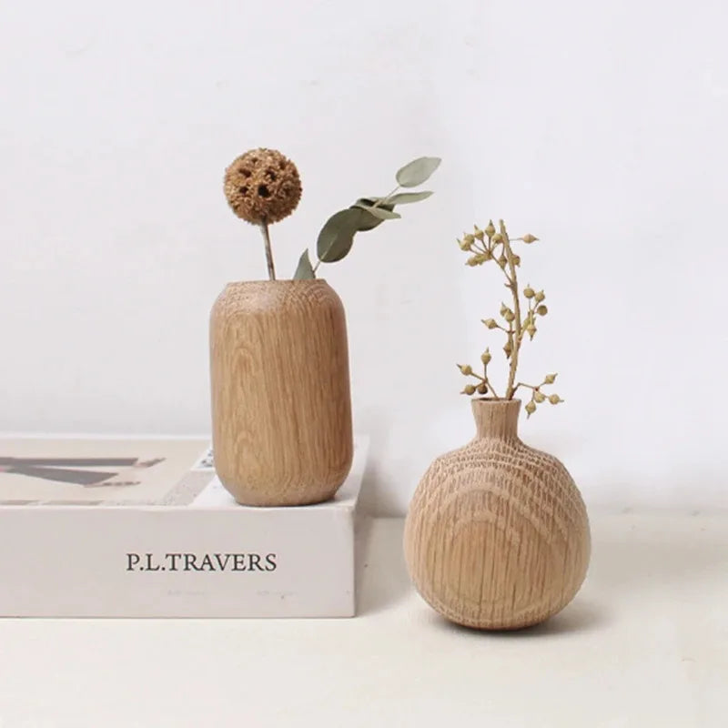 Four Japanese wooden flower vase styles displayed together in a flat lay comparison
