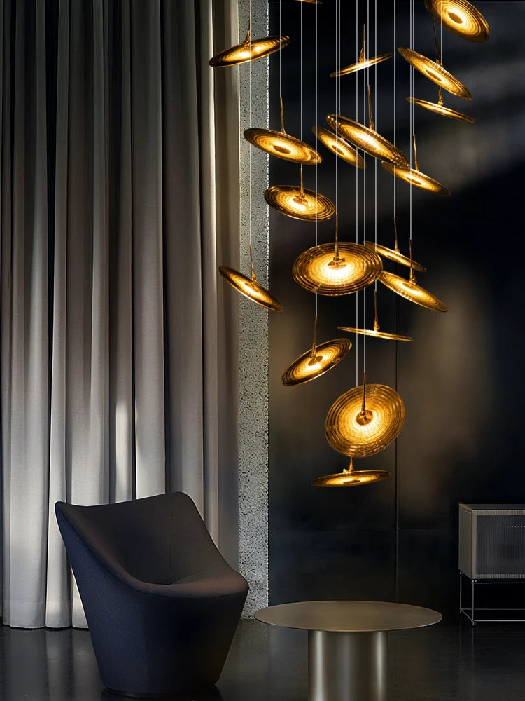 Blown glass staircase chandelier on a plated metal canopy