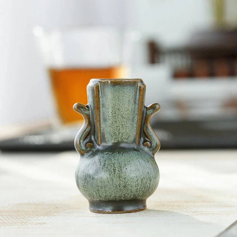 Retro ceramic bud vase ornament on office desk display