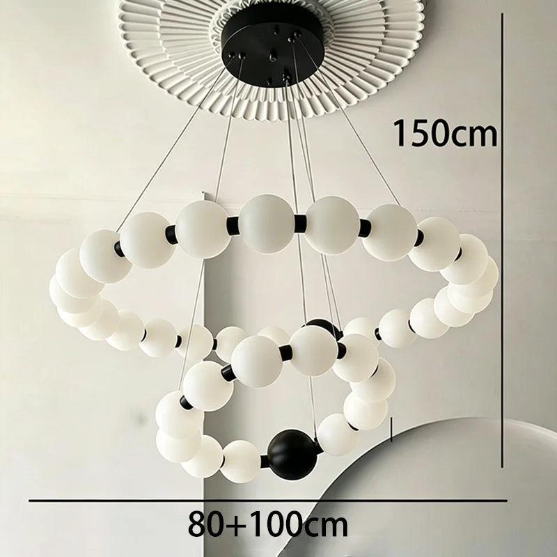 Two ring chandelier, 31.5 and 39.4 in across, in a gold finish