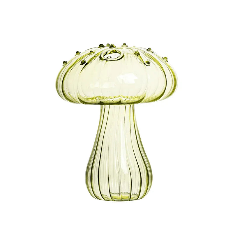 Crystal glass mushroom vases grouped together on eclectic shelf