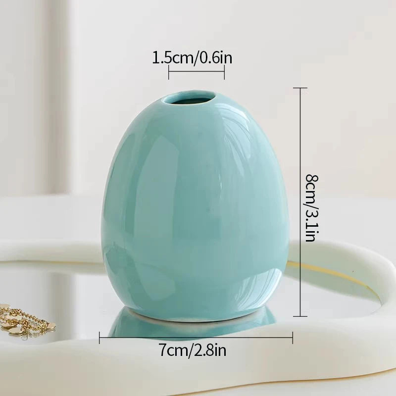Ceramic bud vase set styled for boho wedding reception table
