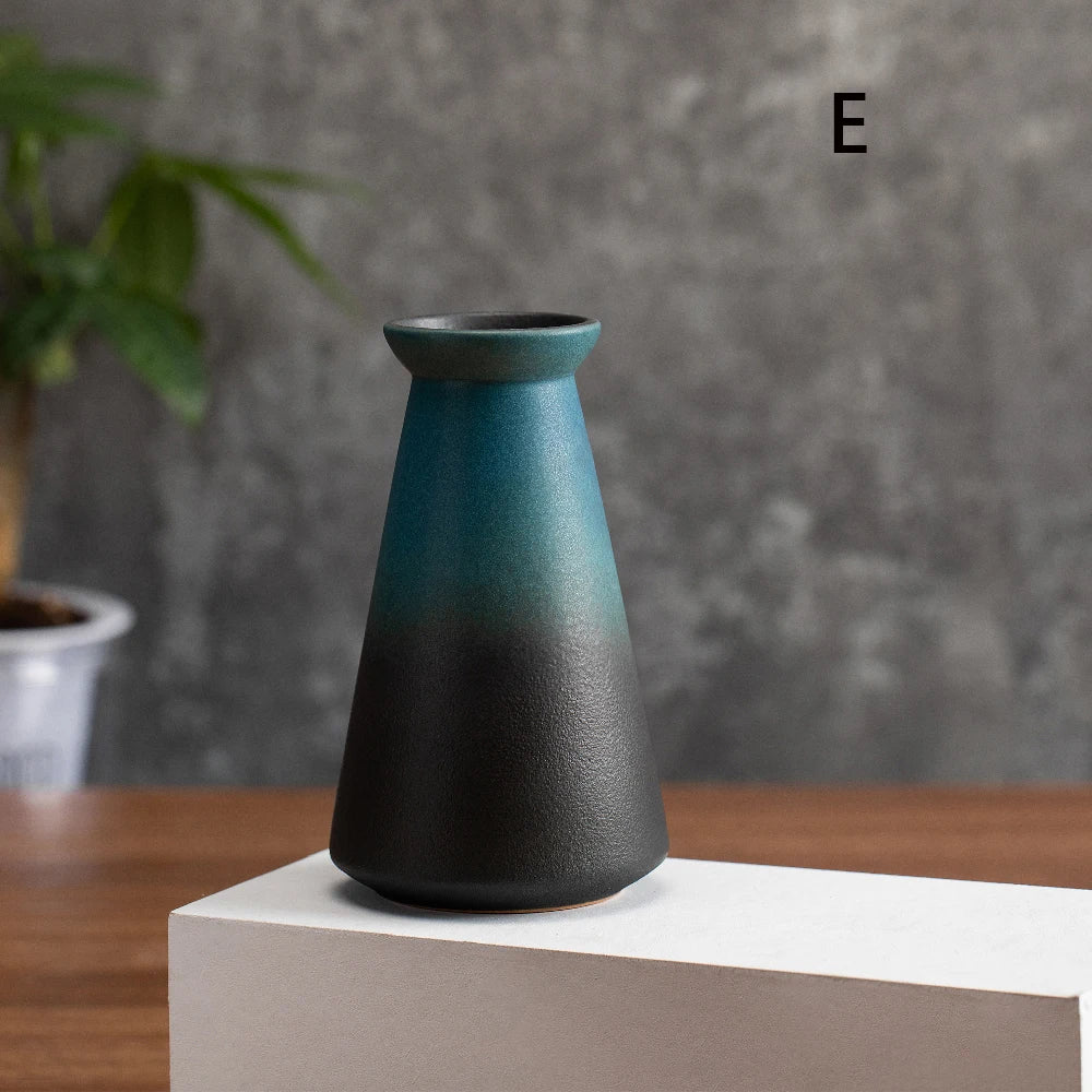 Overhead view of small frosted matte ceramic vase with fresh lavender sprig inside