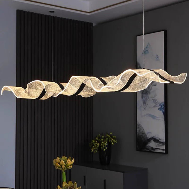 Curved linear chandelier in gold with an iron frame and PMMA shade