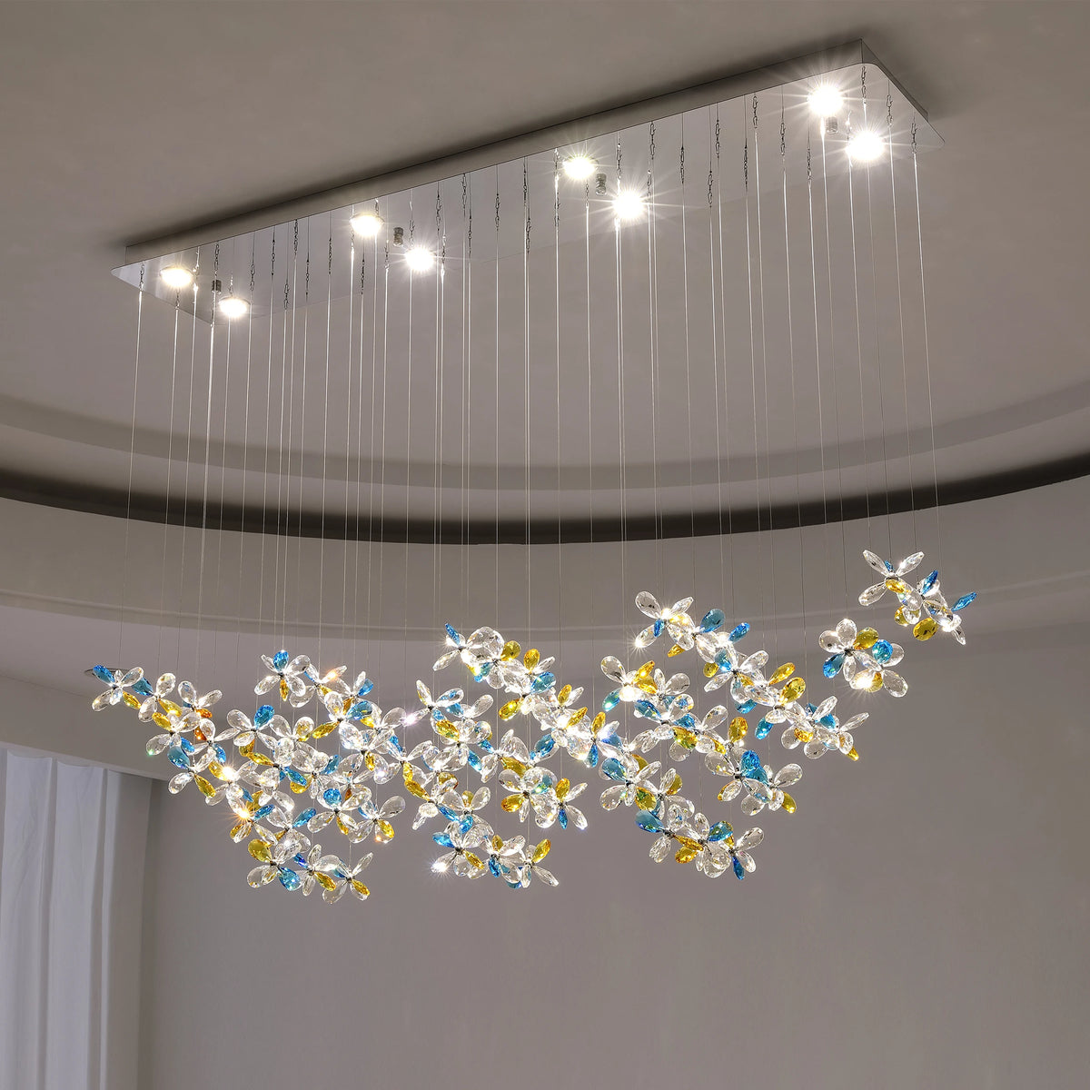 Clear glass detail on a French style iron chandelier in a golden finish
