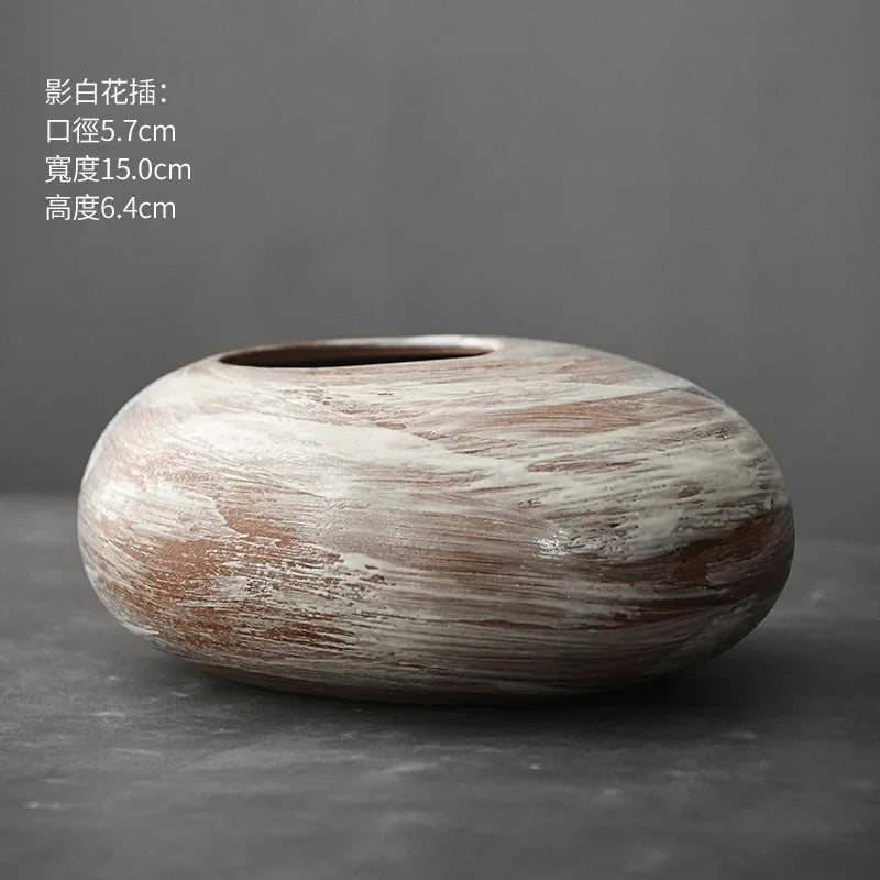 Stone-look black terracotta vase displayed in Japandi interior setting