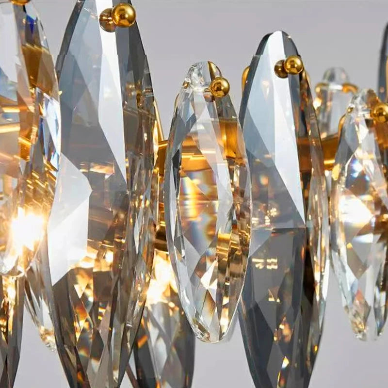 Long crystal bar chandelier in tricolor light for a hotel lobby
