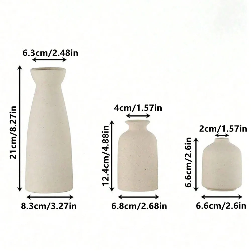 Three-piece boho ceramic vase set holding dried pampas and eucalyptus