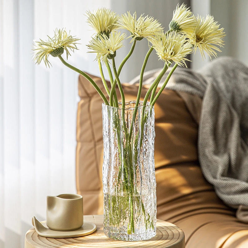 Smoky gray Style B glacier glass vase catching light on a marble surface